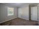 Cozy bedroom with neutral walls and carpet at 2308 Sheryl Dr, Decatur, GA 30032