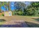Backyard with shed and patio, surrounded by trees at 2308 Sheryl Dr, Decatur, GA 30032