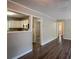 Open living space with hardwood floors and kitchen peek at 2308 Sheryl Dr, Decatur, GA 30032