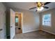 Bedroom with carpet, ceiling fan and access to another room at 2308 Sheryl Dr, Decatur, GA 30032