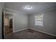 Simple bedroom with grey walls and carpet at 2308 Sheryl Dr, Decatur, GA 30032