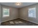 Well-lit bedroom with carpet and two windows at 2308 Sheryl Dr, Decatur, GA 30032