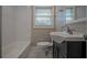 Clean bathroom with white tiled shower and vanity at 2308 Sheryl Dr, Decatur, GA 30032