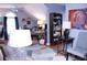 Spacious home office with built in shelving and large artwork at 1563 Poplarwood Nw Ln, Lawrenceville, GA 30043