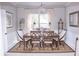 Elegant dining room with chandelier and hardwood floors at 1563 Poplarwood Nw Ln, Lawrenceville, GA 30043