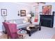 Spacious living room with gray sofa and a black coffee table at 1563 Poplarwood Nw Ln, Lawrenceville, GA 30043