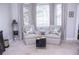 Charming sitting area with two armchairs and a window seat at 1563 Poplarwood Nw Ln, Lawrenceville, GA 30043