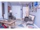 Home office with a wooden desk and comfortable seating at 1563 Poplarwood Nw Ln, Lawrenceville, GA 30043