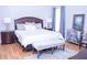 Large main bedroom with a king-size bed and hardwood floors at 1563 Poplarwood Nw Ln, Lawrenceville, GA 30043