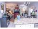Kitchen with granite island, view into adjoining living room at 1563 Poplarwood Nw Ln, Lawrenceville, GA 30043