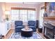 Cozy living room features a fireplace and comfortable seating at 1563 Poplarwood Nw Ln, Lawrenceville, GA 30043