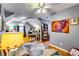 Bright home office features hardwood floors, built-in shelving, and large artwork at 1563 Poplarwood Nw Ln, Lawrenceville, GA 30043