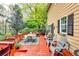 Spacious deck with comfortable seating and a dining area, overlooking the backyard at 1563 Poplarwood Nw Ln, Lawrenceville, GA 30043