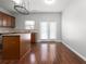 Kitchen with island, wood cabinets, granite countertops, and hardwood floors at 3034 Liberty Nw Way, Atlanta, GA 30318
