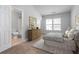 Spacious bedroom with carpeted floor, large window, and ensuite bathroom at 3034 Liberty Nw Way, Atlanta, GA 30318