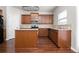 Kitchen with island, granite countertops, and wood cabinets at 3034 Liberty Nw Way, Atlanta, GA 30318