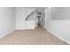 Spacious living room with neutral carpeting and staircase access at 3034 Liberty Nw Way, Atlanta, GA 30318