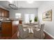 Kitchen with island, wood cabinets, granite countertops, and a breakfast nook at 3034 Liberty Nw Way, Atlanta, GA 30318