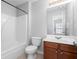Clean bathroom with a tub, toilet and vanity at 3034 Liberty Nw Way, Atlanta, GA 30318