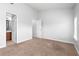 Bright bedroom with carpeted floor and ensuite bathroom at 3034 Liberty Nw Way, Atlanta, GA 30318