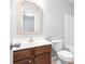 Simple bathroom with a toilet, bathtub, and vanity at 3034 Liberty Nw Way, Atlanta, GA 30318