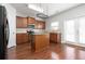 Kitchen with island, stainless steel appliances, and wood cabinets at 3034 Liberty Nw Way, Atlanta, GA 30318