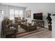 Bright living room with comfy furniture and TV at 3034 Liberty Nw Way, Atlanta, GA 30318