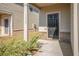 Front door entry with black door and brick accents at 11948 Brightside Pkwy, Hampton, GA 30228