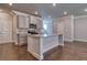 Spacious kitchen with an island, granite countertops, and stainless steel appliances at 211 Depot Landing Rd, Auburn, GA 30011