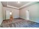 Large bedroom with carpet flooring and access to a hallway at 211 Depot Landing Rd, Auburn, GA 30011