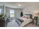 Bright bedroom with a metal bed frame and large window at 12 Depot Landing Way # 77A, Auburn, GA 30011