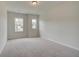 Bright bedroom featuring neutral walls and carpet at 12 Depot Landing Way # 77A, Auburn, GA 30011