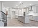 Modern kitchen with gray cabinets, quartz countertops, and stainless steel appliances at 385 Riverwood Pass, Dallas, GA 30157