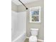 Simple bathroom featuring a tub and shower combo at 5401 Stone Cove Sw Dr, Atlanta, GA 30331