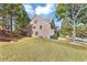 Side view of two story home showcasing landscaping at 5401 Stone Cove Sw Dr, Atlanta, GA 30331