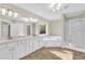 Elegant bathroom with double vanity, soaking tub, and separate shower at 5401 Stone Cove Sw Dr, Atlanta, GA 30331