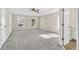 Large main bedroom with ceiling fan and carpet at 5401 Stone Cove Sw Dr, Atlanta, GA 30331
