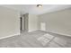 Bedroom with grey carpet and window, access to hall at 5401 Stone Cove Sw Dr, Atlanta, GA 30331