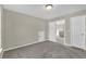 Bedroom with grey carpet, and access to hall at 5401 Stone Cove Sw Dr, Atlanta, GA 30331