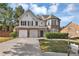 Two-story brick home with a two car garage and well-manicured lawn at 5401 Stone Cove Sw Dr, Atlanta, GA 30331