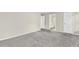 Large bedroom with grey carpet and access to bathroom at 5401 Stone Cove Sw Dr, Atlanta, GA 30331