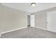 Spacious bedroom with neutral walls and grey carpet at 5401 Stone Cove Sw Dr, Atlanta, GA 30331