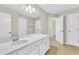 Clean bathroom with white vanity and tile floor at 5401 Stone Cove Sw Dr, Atlanta, GA 30331