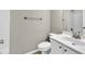 Bathroom with white vanity, shower/tub combo, and neutral decor at 5401 Stone Cove Sw Dr, Atlanta, GA 30331