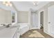 Bathroom featuring a soaking tub, shower, and double vanity at 5401 Stone Cove Sw Dr, Atlanta, GA 30331