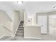 Upstairs hall with staircase and access to bedrooms at 5401 Stone Cove Sw Dr, Atlanta, GA 30331