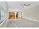 Open living room with kitchen views and ceiling fan at 5401 Stone Cove Sw Dr, Atlanta, GA 30331