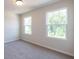 Bright bedroom with two large windows and neutral carpeting at 134 Henley St, Canton, GA 30114