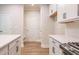 Kitchen view with white cabinets and hardwood floors at 134 Henley St, Canton, GA 30114