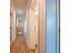 Bright hallway with hardwood floors and access to bedrooms and bathroom at 134 Henley St, Canton, GA 30114